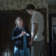 The Kid (Bill Skarsgård) towers over Ruth.